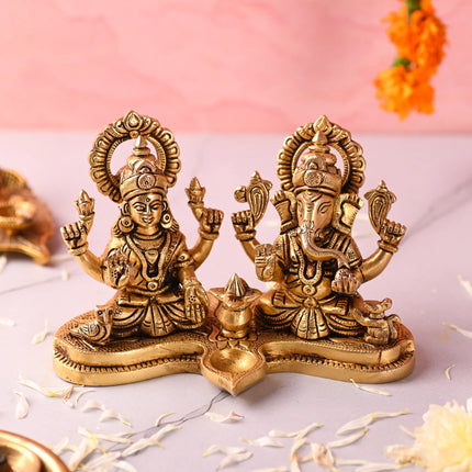 Brass Ganesha and Lakshmi Sitting Idol With Diya (5 Inch)
