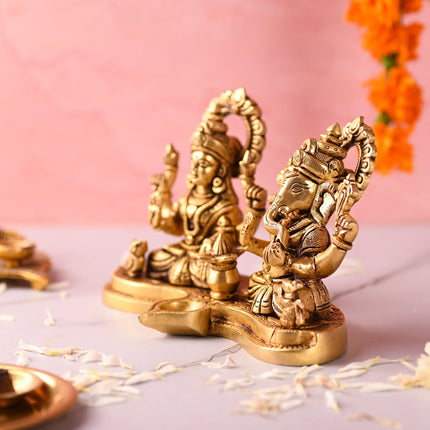 Brass Ganesha and Lakshmi Sitting Idol With Diya (5 Inch)