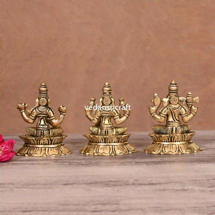 Brass Sitting Ganesha Lakshmi Saraswati On Lotus (3 Inch)