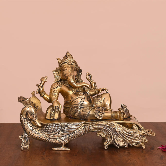 Brass Ganesha Resting On Peacock Couch (7.7 Inch)