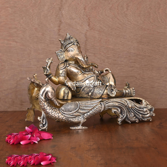 Brass Ganesha Resting On Peacock Couch (7.7 Inch)